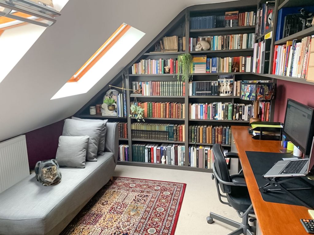 built in home office desk and shelves in a loft