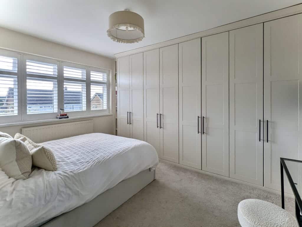 wardrobes across a full bedroom wall